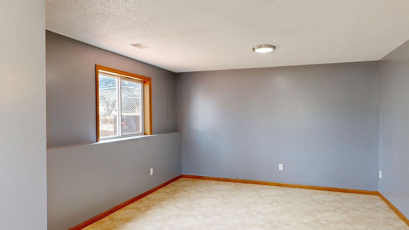 A freshly painted interior room with new wall finish and wood trim